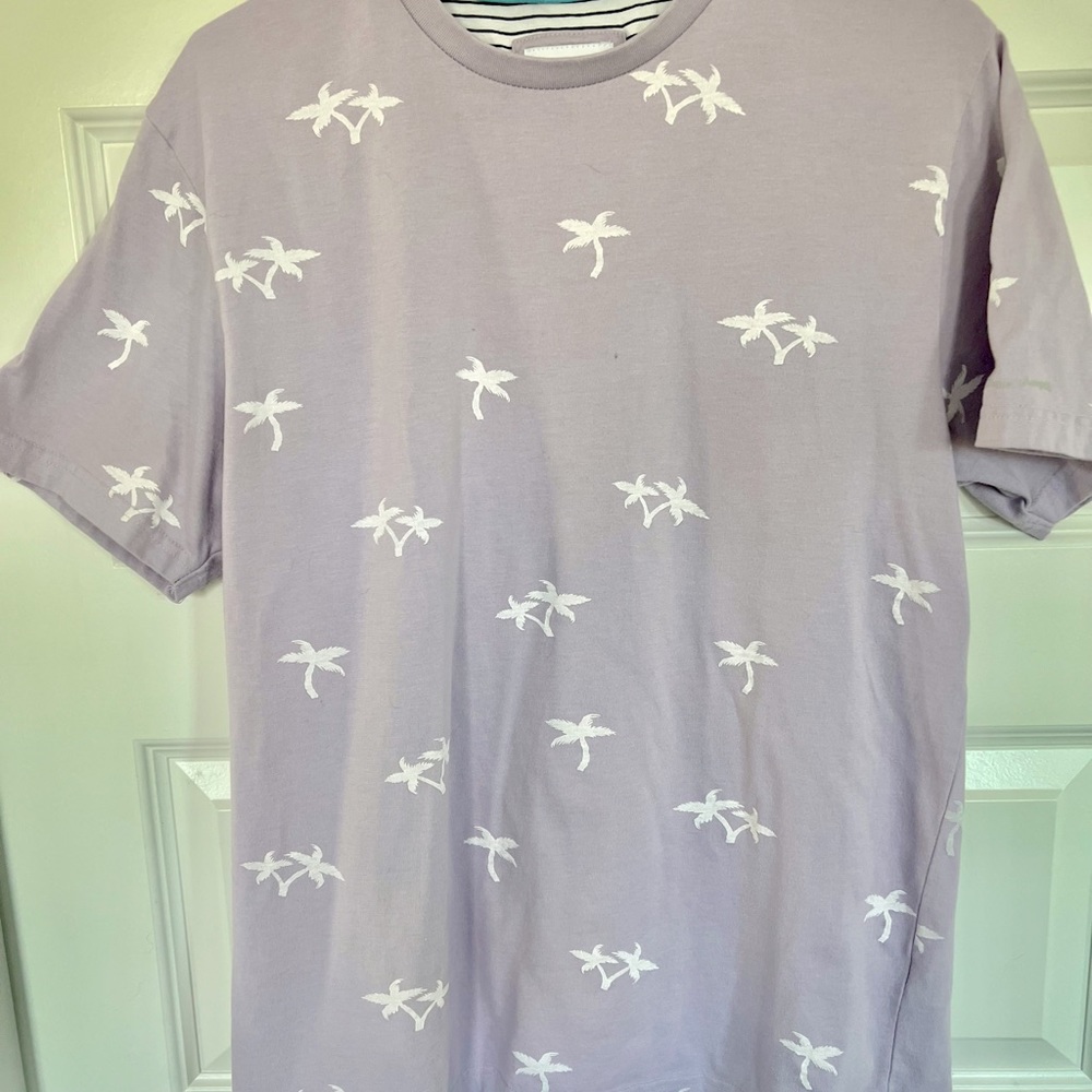 Soft lavender t-shirt brand is Denim & Flowers by Ricky Singh